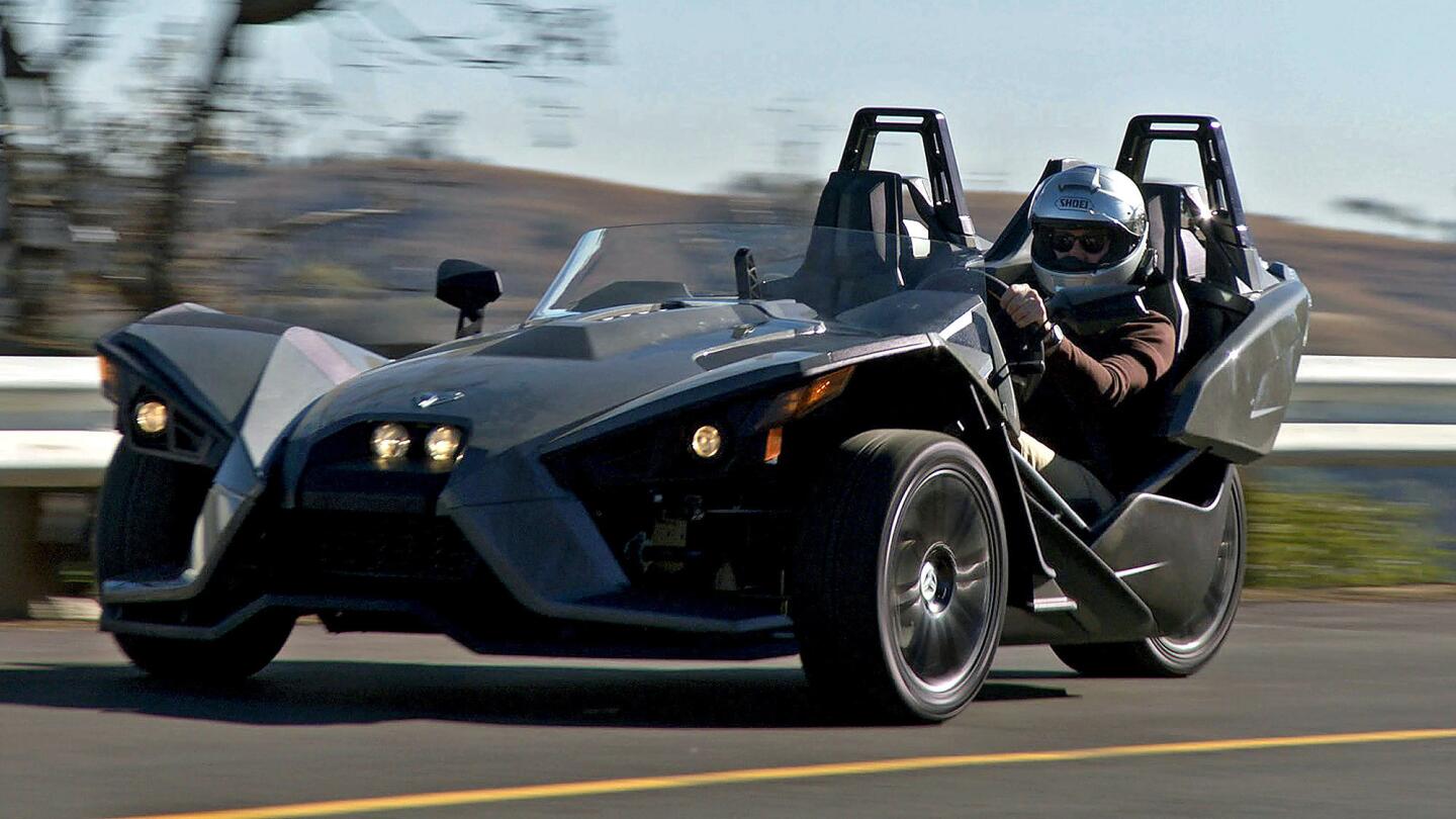 Polaris has entered the three-wheeled market with its Slingshot, a go-cart like road racer. Unlike Harley's Trikes or Can-Am's Spyders, it offers side-by-side seating for driver and passenger. But like those other machines, it's meant to be enjoyed with a helmet.
