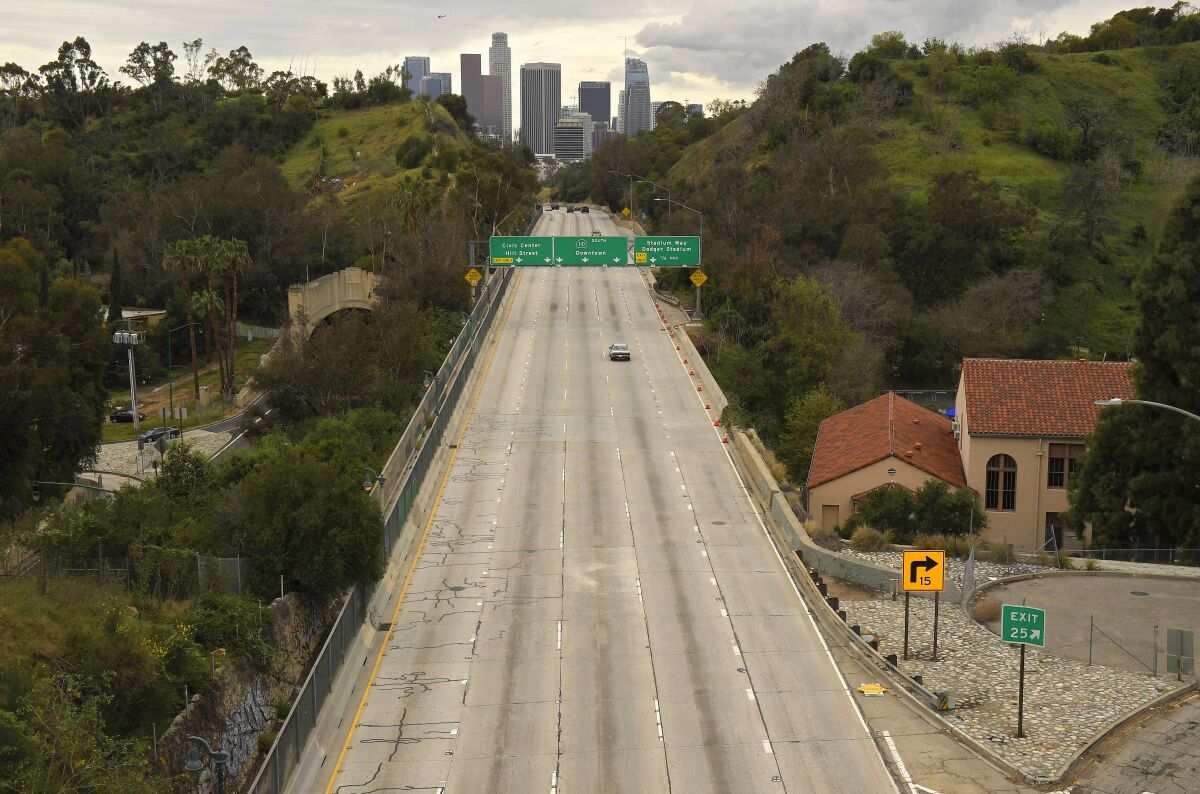 The 110 Freeway heading into downtown Los Angeles is nearly empty on March 20, the day after California Gov. Newsom issued a statewide coronavirus stay-at-home order. 