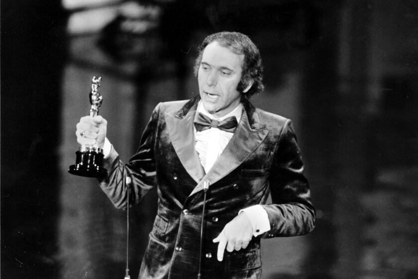 FILE - Producer Albert S. Ruddy accepts the Oscar for best picture for "The Godfather" at the 45th Annual Academy Awards ceremony in Los Angeles, Calif., on March 27, 1973. The Canadian-born producer and writer who won Oscars for “罢丑别 Godfather” and “Million Dollar Baby,” died Saturday, May 25, 2024, at age 94. (AP Photo, File)