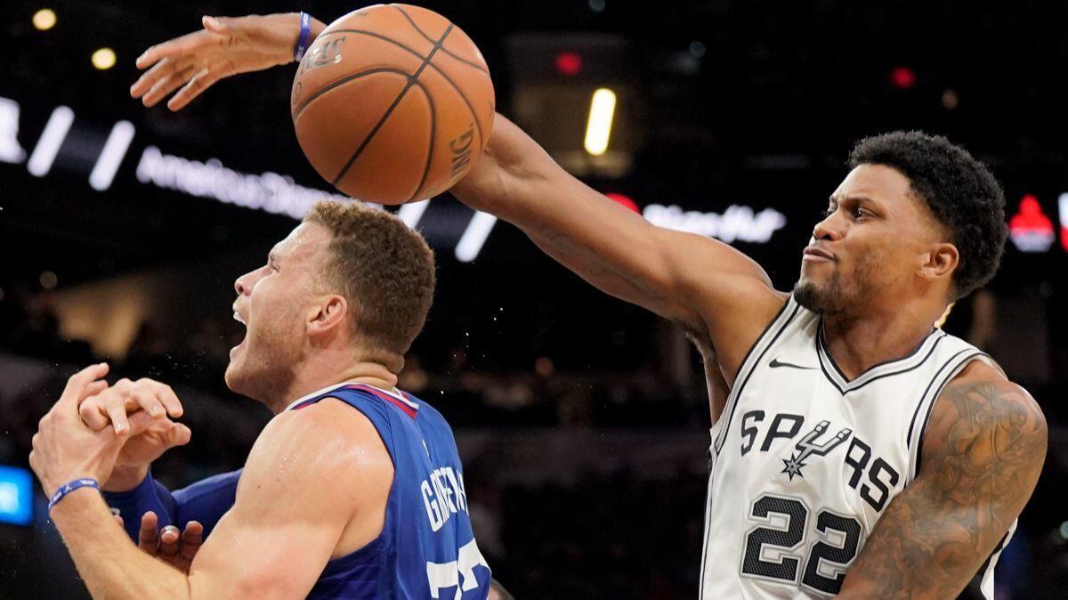 San Antonio Spurs forward Rudy Gay (22) swats the ball away from Clippers' Blake Griffin during the first half on Tuesday.
