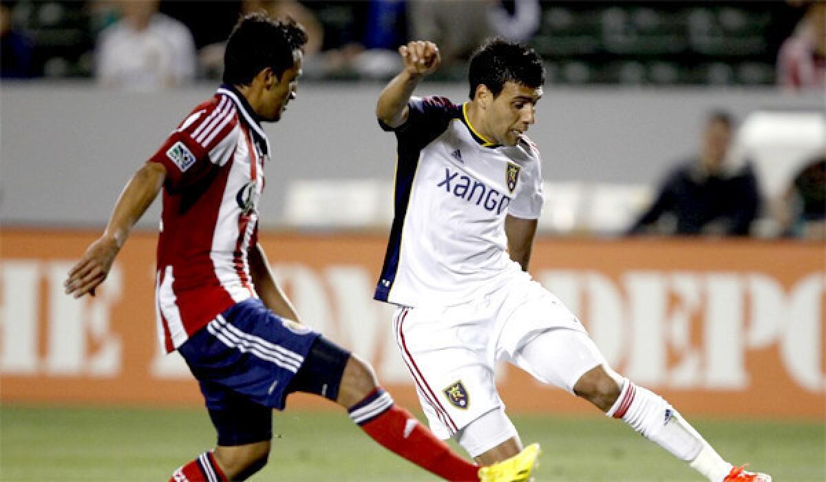 Chivas USA midfielder Martin Ponce defends Real Salt Lake midfielder Javier Morales on May 19, 2013.