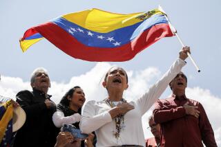 Opposition leader Maria Corina Machado waves a Venezuelan national flag during a rally to protest official results that declared President Nicolas Maduro the winner of the July presidential election, in Caracas, Venezuela, Saturday, Aug. 17, 2024. (AP Photo/Cristian Hernandez)