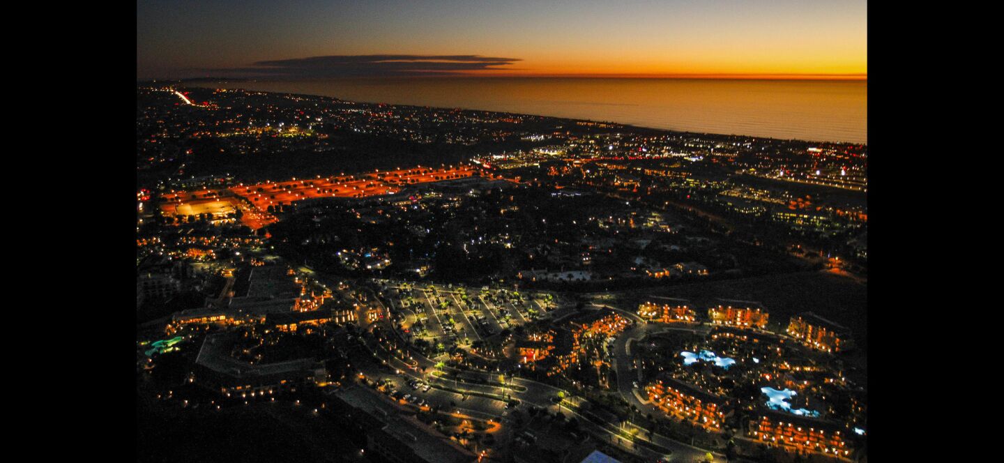 Carlsbad as viewed from Kurt Dawson's helicopter while he flies over over coastal North County after sunset.