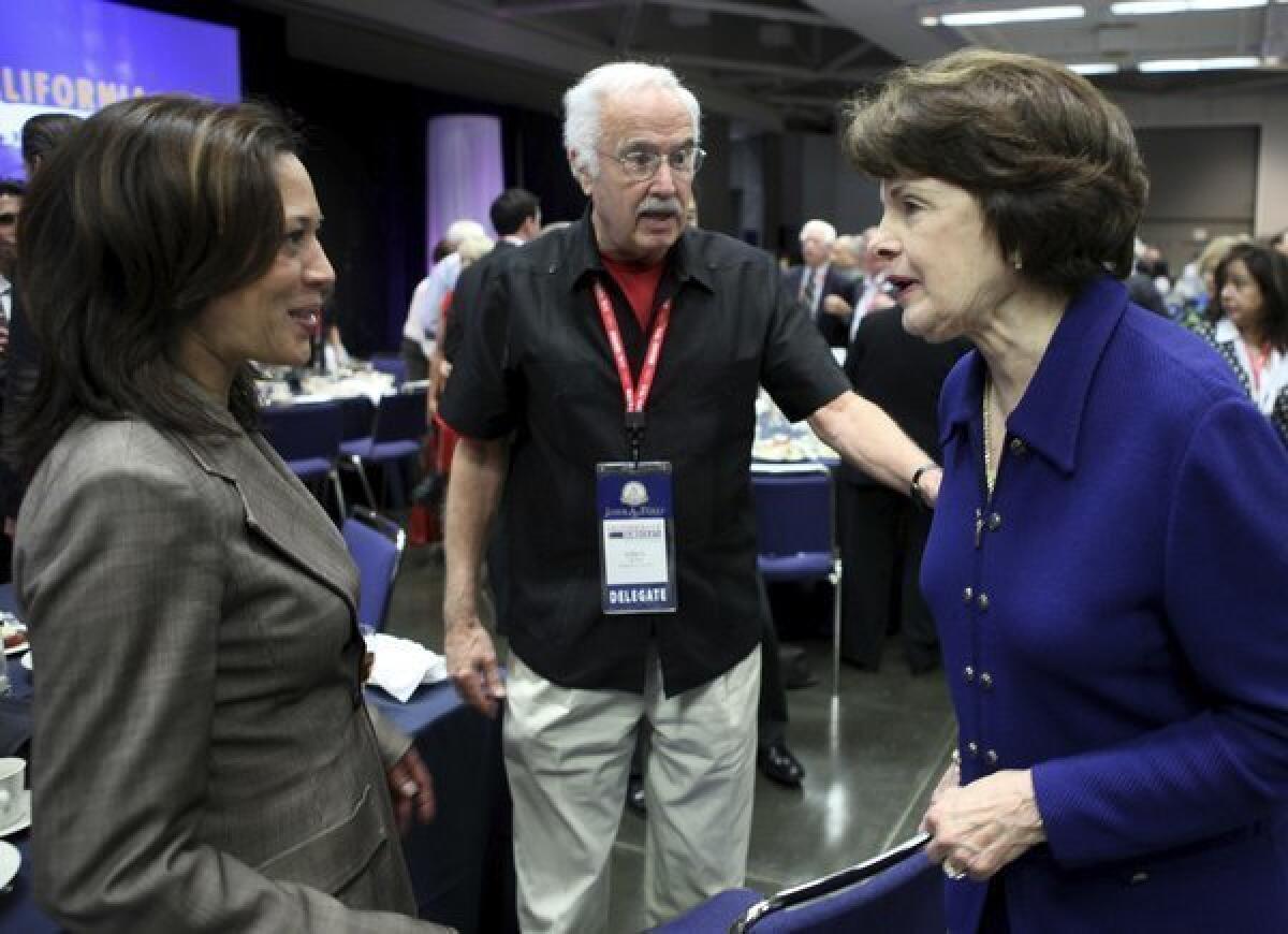 Democratic State Chairman John Burton chats with U.S. Sen. Dianne Feinstein, right, and California Atty. Gen. Kamala Harris, left, at the party's 2011 state convention in Sacramento.