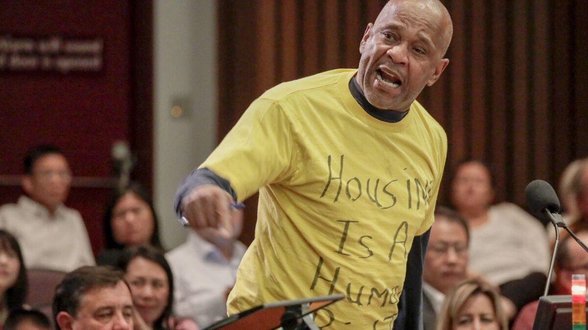 Kenneth Batiste advocates for the homeless during the Orange County Board of Supervisors meeting Tuesday.