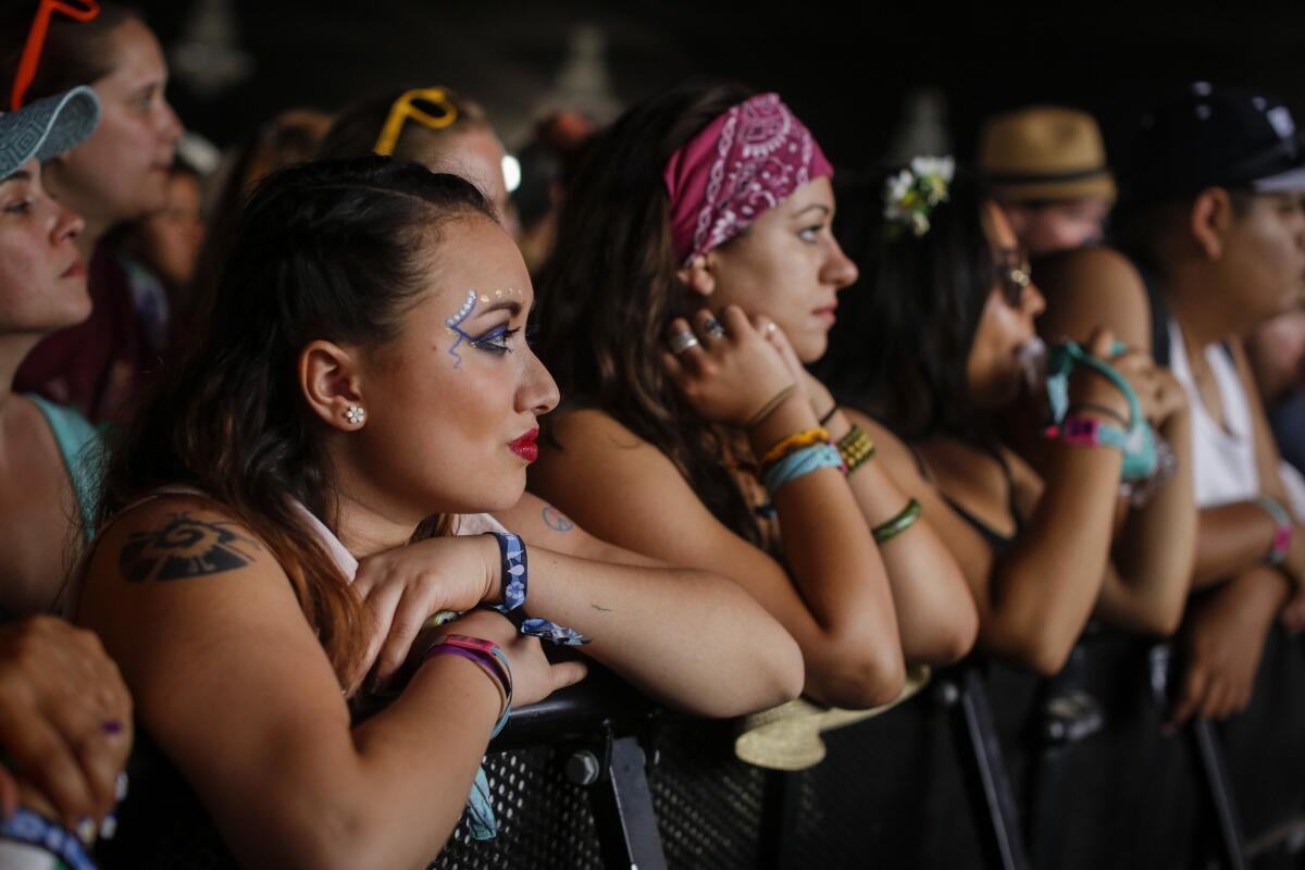 Music fans, some with elaborately painted faces, wait for Kate Nash to begin on the first day of the second weekend of the Coachella Valley Music and Arts Festival.