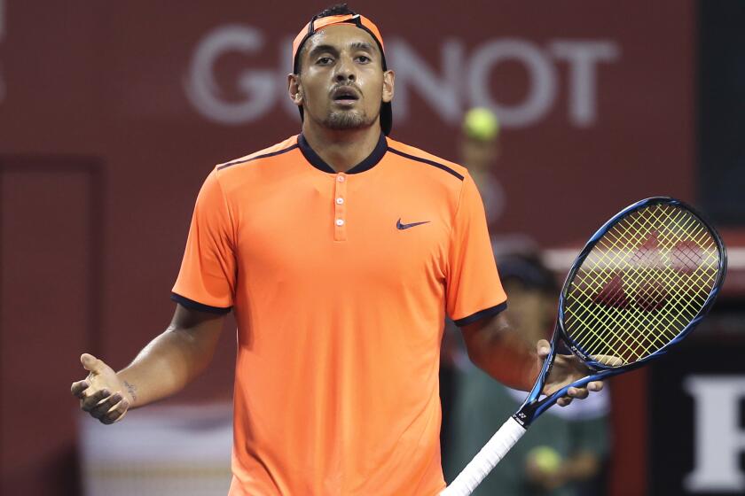 Nick Kyrgios reacts after getting a point against Gael Monfils during the semifinal match at the Japan Open on Oct. 8.