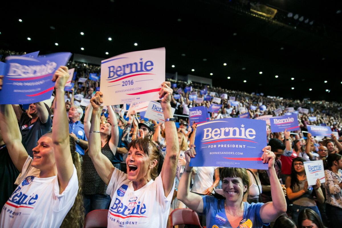 Supporters of Presidential candidate Bernie Sanders cheer as he addresses the crowd during his campaign event in Los Angeles on Monday.