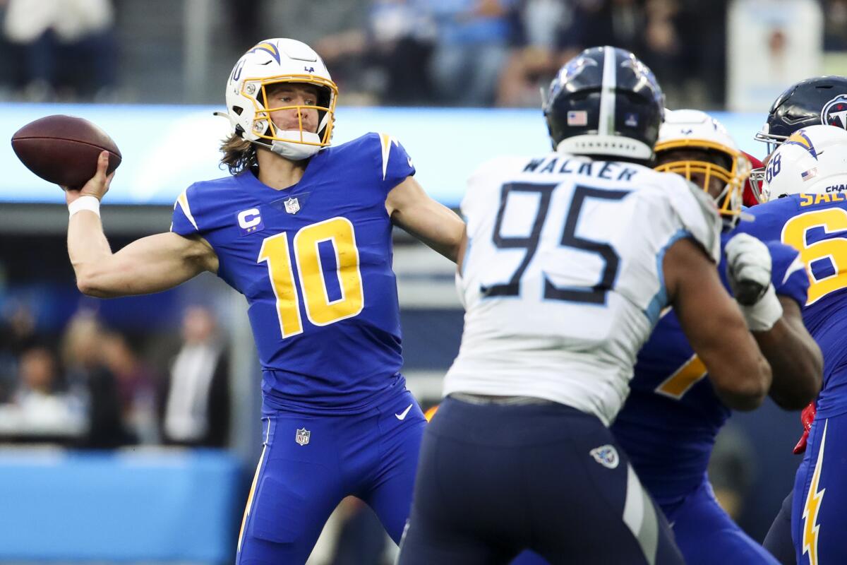 Los Angeles, CA - December 18: Los Angeles Chargers quarterback Justin Herbert (10) looks to throw.