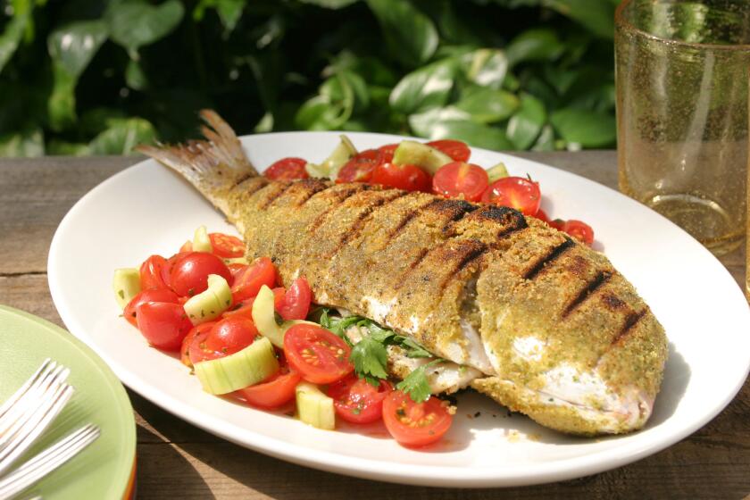 A whole snapper is covered in seasoned bread crumbs then grilled. Recipe: Grilled whole snapper.