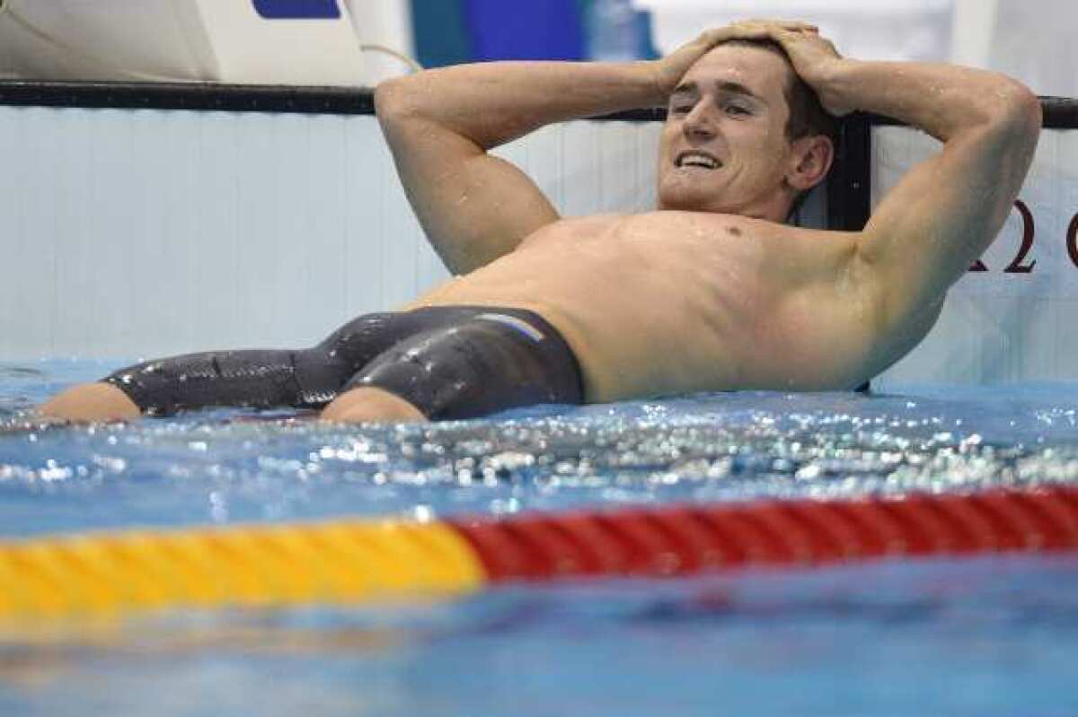 South Africa's Cameron van der Burgh relaxes after breaking the world record Sunday in the men's 100-meter breaststroke.