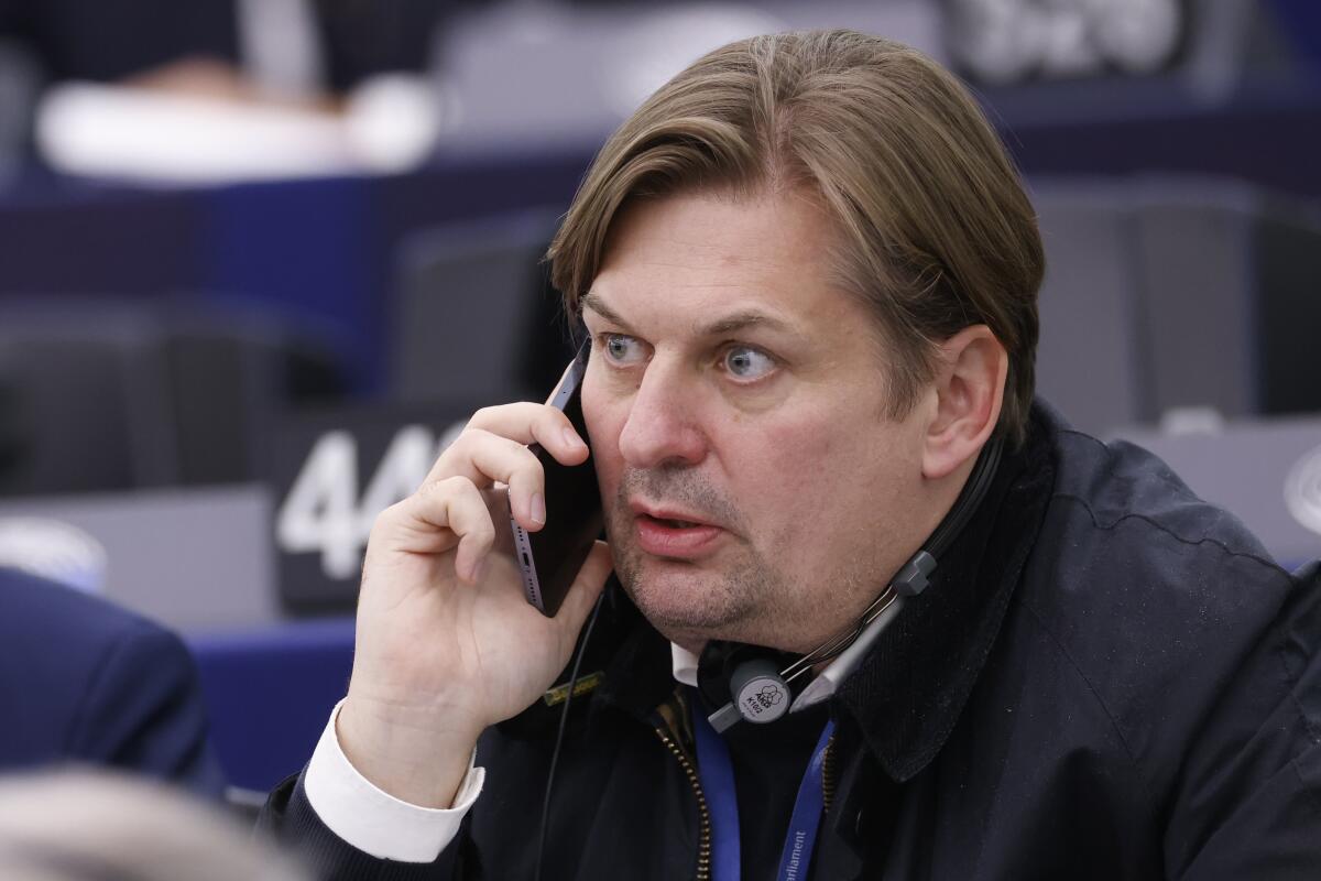 Maximilian Krah, of the far-right Alternative for Germany party, listening on a phone 