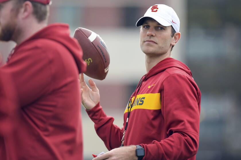This Tuesday, March 5, 2019 photo provided by University of Southern California Athletics shows new USC offensive coordinator Graham Harrell. Harrell stepped into one of the highest-profile assistant jobs in college football after Kliff Kingsbury left USC without calling a play. The Trojans' new offensive coordinator is working hard to get up to speed in spring practice. (John McGillen/USC Athletics via AP)