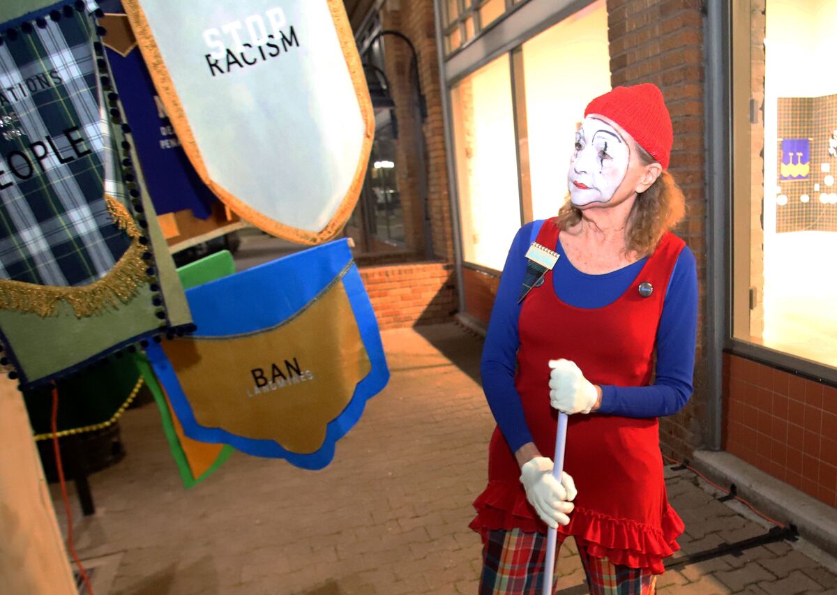 Sister Ellen O'Leary performs her mime routine in front of the Sisters InfoShop.