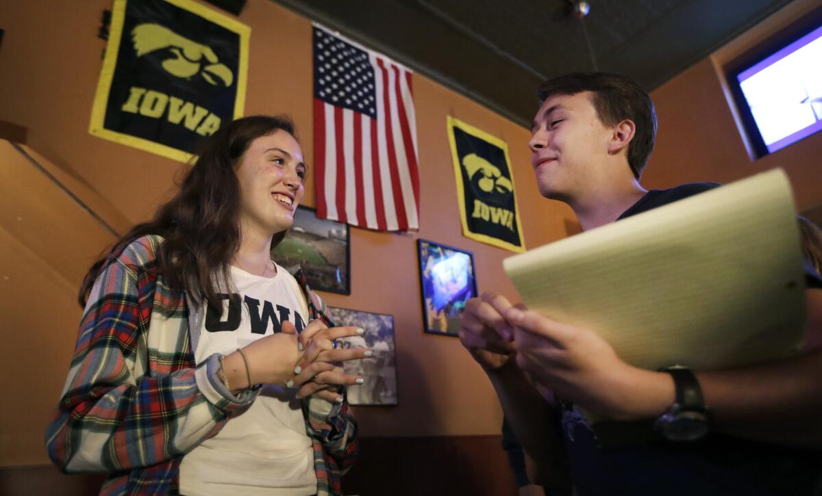 University of Iowa students Abigail Simon and Mitchell Dunn talk during a Hillary Clinton campaign organizing event in Iowa City.