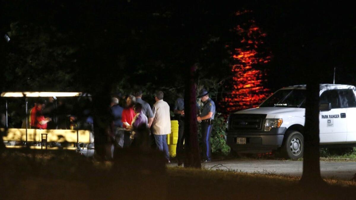 Rescue crews work at the scene of a deadly boat accident at Table Rock Lake in Branson, Mo., on July 19.