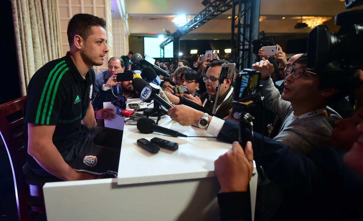 Javier Hernandez of Mexico's World Cup squad takes a question from a Korean journalist during Mexico Media Day on May 25, 2018 in Beverly Hills, California ahead a pre-World Cup soccer friendly against Wales in Pasadena on May 28. - Mexico is drawn in the same first round group at the 2018 World Cup beginning in June with South Korea, Sweden and Germany. (Photo by Frederic J. BROWN / AFP) (Photo credit should read FREDERIC J. BROWN/AFP via Getty Images)