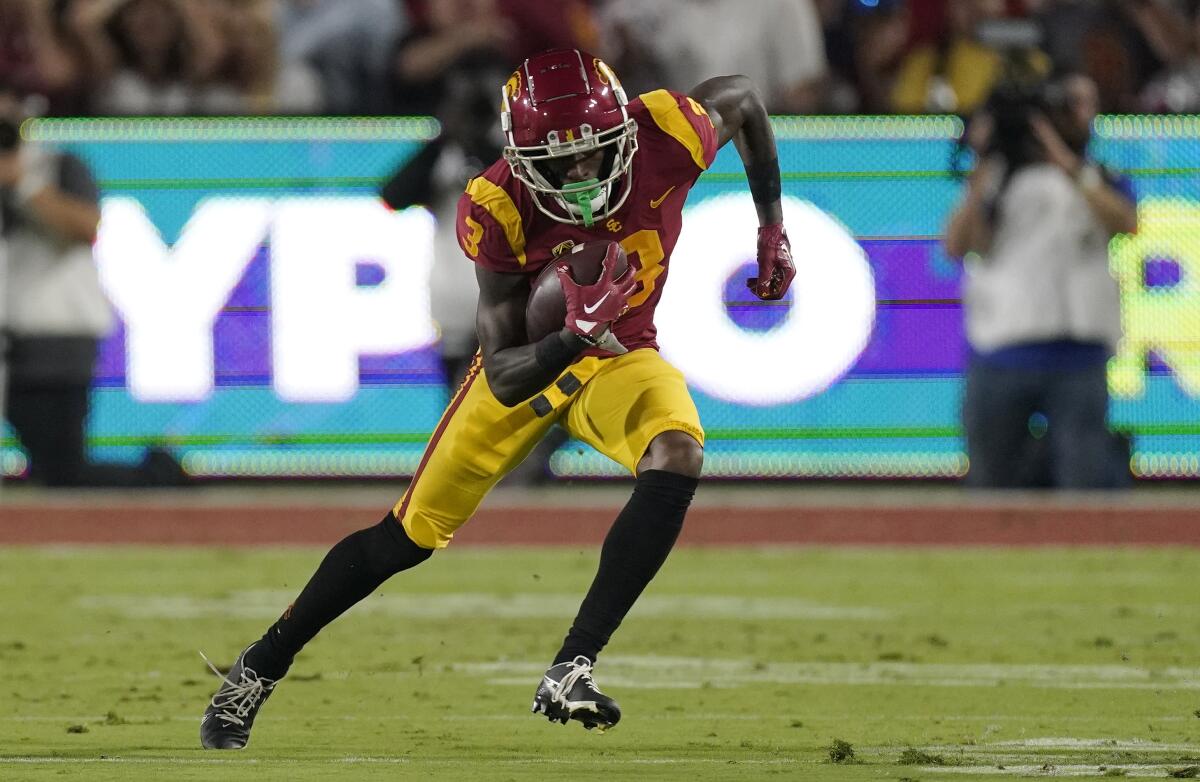 USC wide receiver Jordan Addison runs with the ball