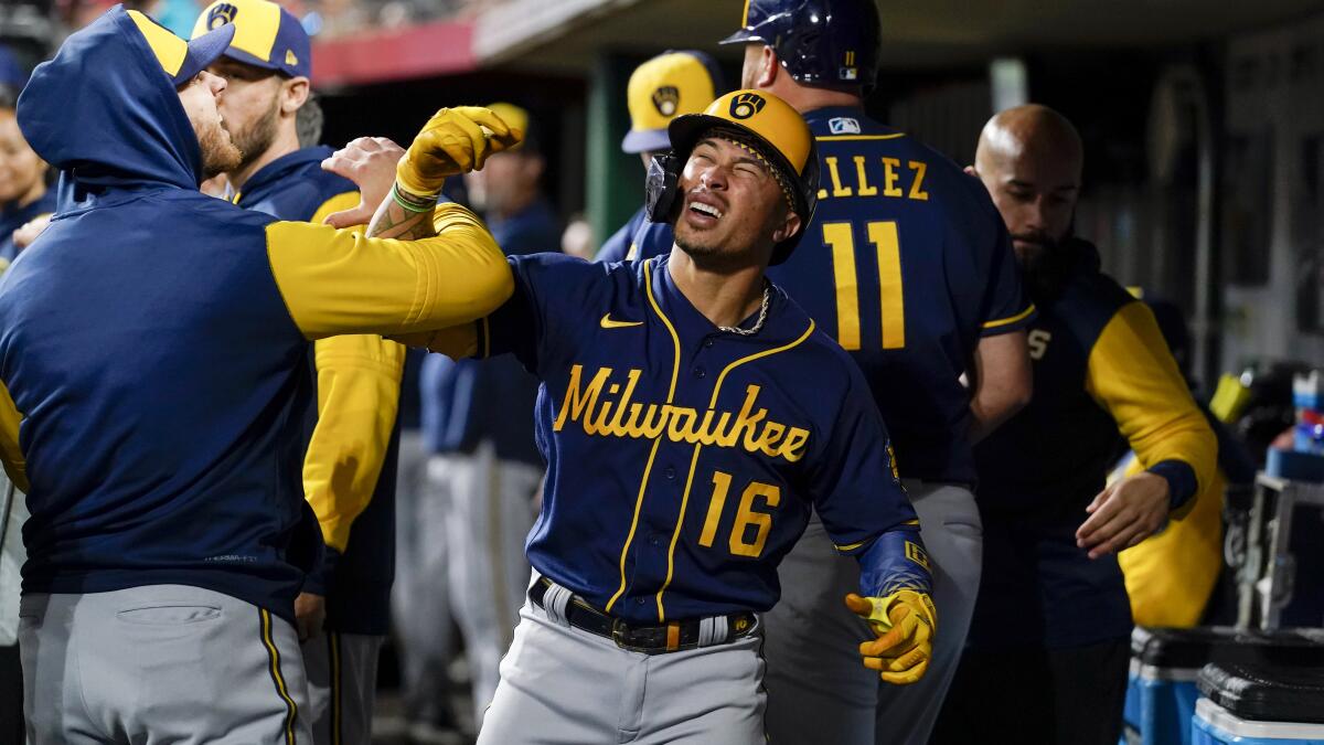 Kolten Wong hits three home runs to carry Brewers to 5-1 win