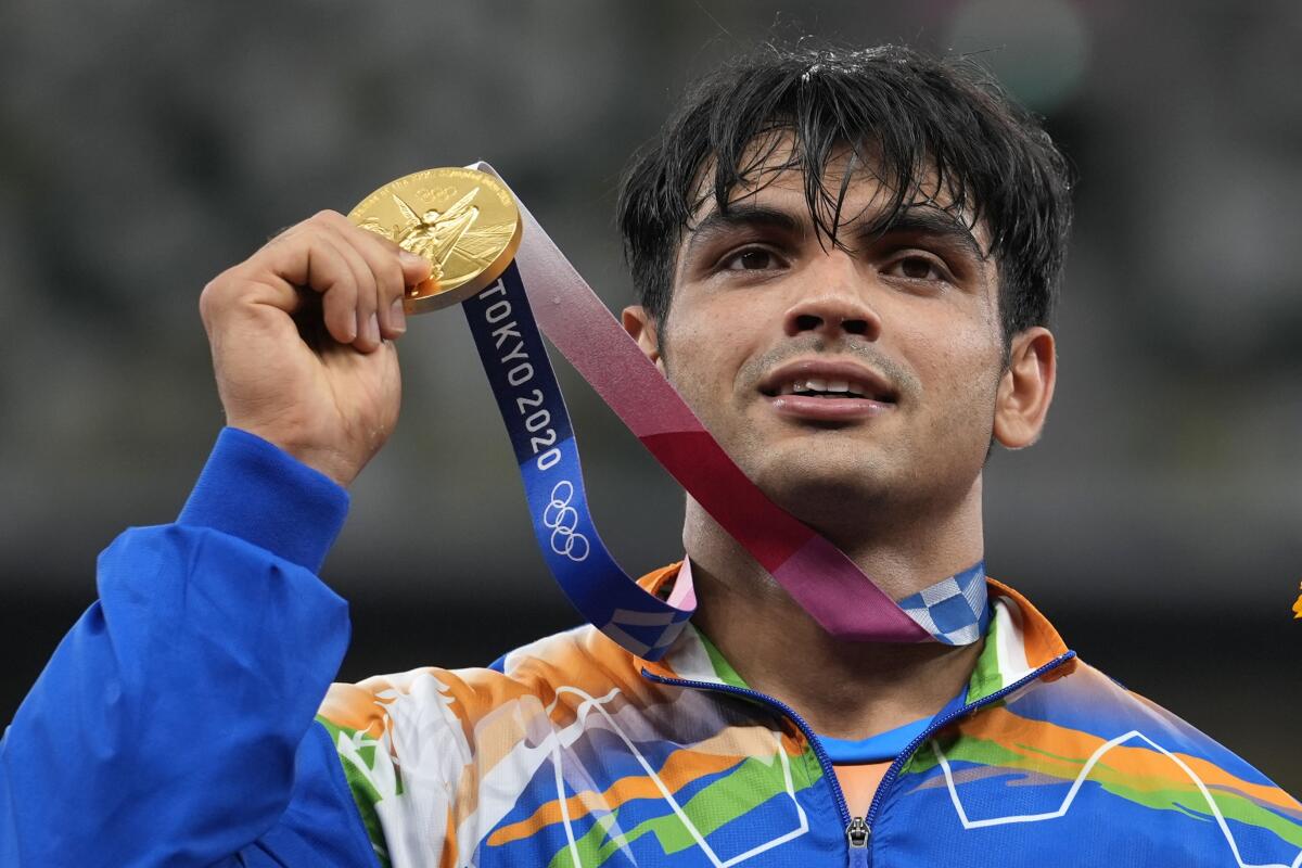 Gold medalist Neeraj Chopra of India celebrates after winning the men's javelin throw on Saturday.