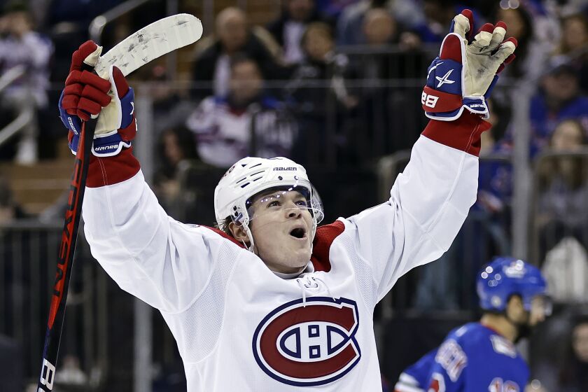 FILE - Montreal Canadiens right wing Cole Caufield reacts after scoring a goal against the New York Rangers in the third period of an NHL hockey game Sunday, Jan. 15, 2023, in New York. The Canadiens have signed Caufield to eight-year contract extension on Monday, June 5, 2023. The deal, which will pay the 22-year-old winger an average annual salary of $7.85 million, runs through the 2030-31 season.(AP Photo/Adam Hunger, File)