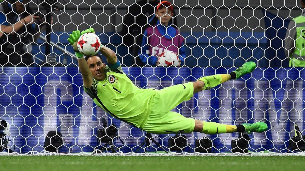 Chile goalkeeper Claudio Bravo blocks a shot by Portugal's forward Ricardo Quaresma during the shootout phase of the Confederations Cup semifinal on Wednesday.