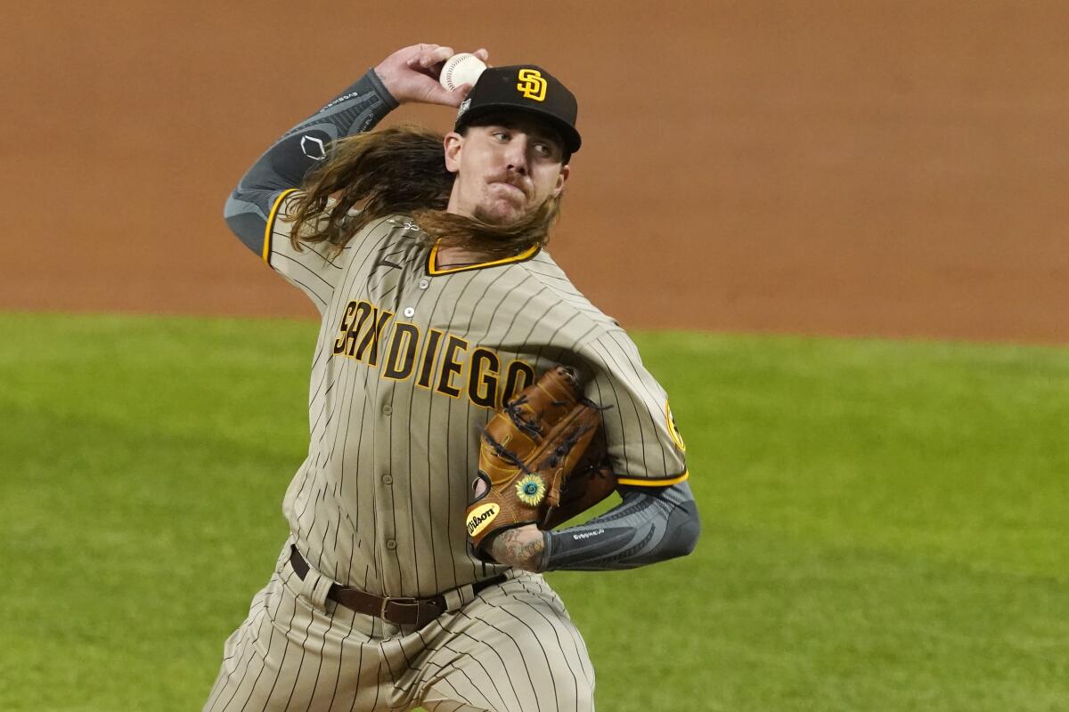 San Diego Padres starter Mike Clevinger pitches to the Dodgers.