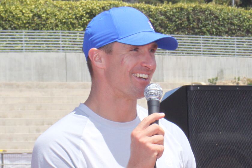 New Orleans Saints quarterback and FNA co-founder Drew Brees speaks at La Jolla High School’s athletic field.