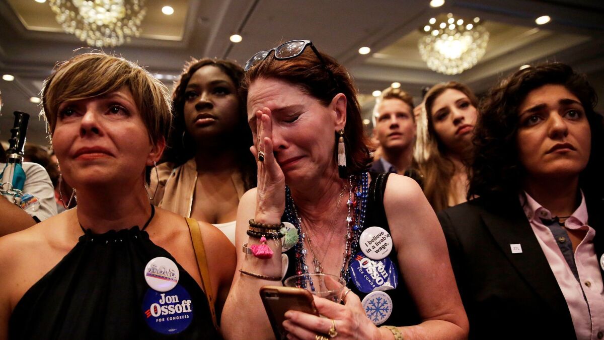 Supporter Jan Yanes cries as the Democratic candidate for Georgia's 6th Congressional District, Jon Ossoff, concedes to Republican Karen Handel at his election-night party in Atlanta on June 20.