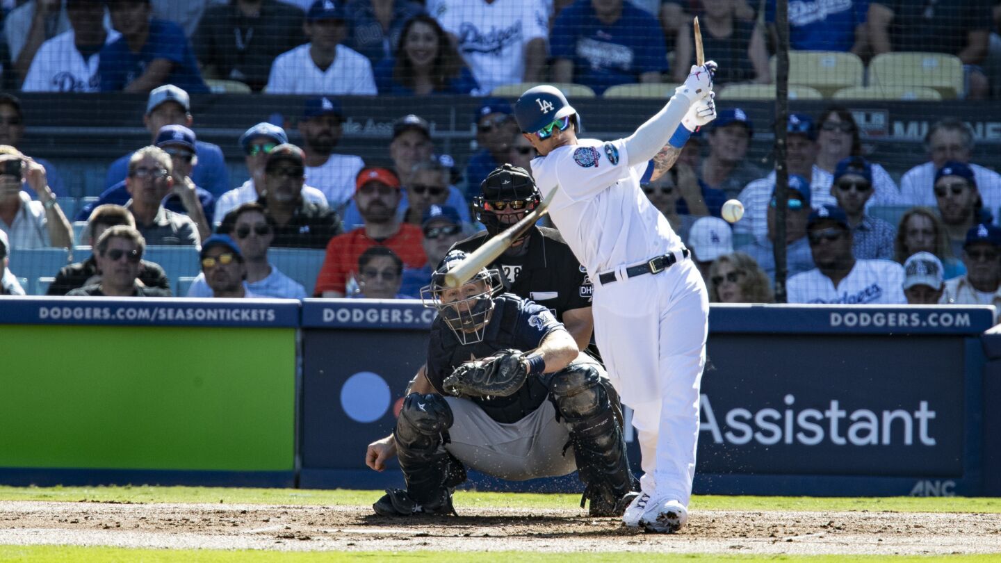 Dodgers shortstop Manny Machado breaks his bat on a ground out in there first inning.