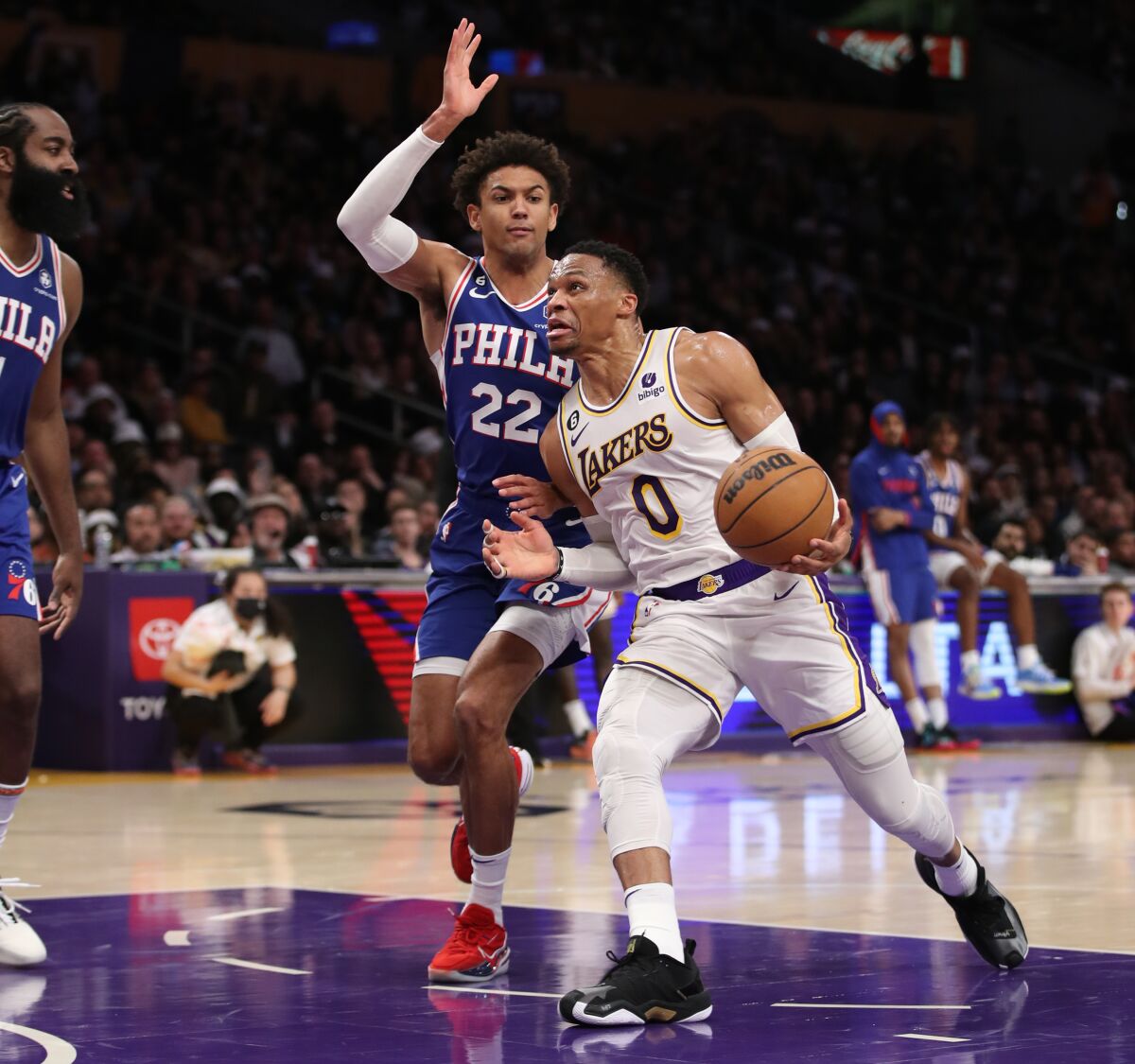 Lakers point guard Russell Westbrook drives around 76ers guard Matisse Thybulle.