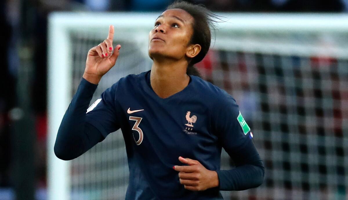 French defender Wendie Renard celebrates after one of her two goals in the Women's World Cup opener.