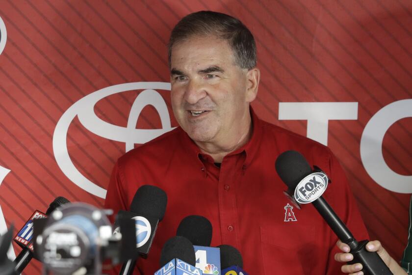 Tim Mead, the Los Angeles Angels' vice president of communications, talks to reporters during a news conference.