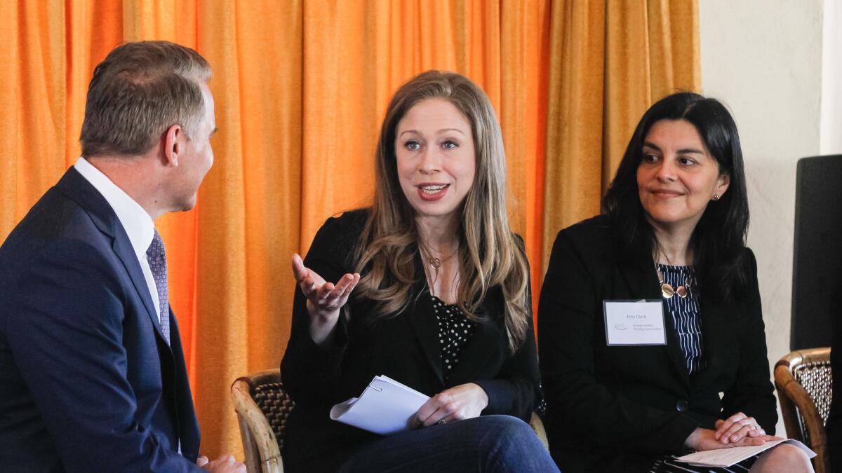 Chelsea Clinton, vice chair of the Clinton Foundation, speaks during a panel discussion of the Strong Families Thriving Communities coalition on Thursday at Balboa Park. Panel members (from left) are Steve Atkinson, 10News, Chelsea Clinton, Amy Aparicio Clark, Aetna Foundation.