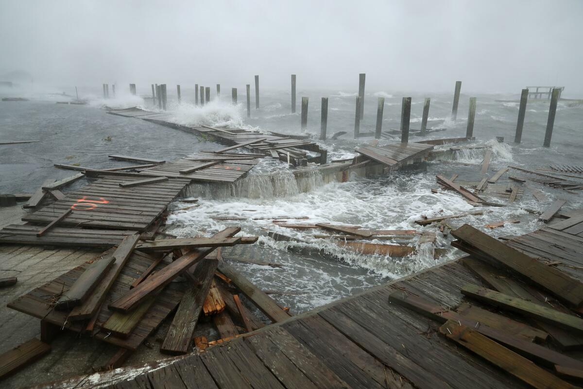 ATLANTIC BEACH, NC - SEPTEMBER 13: Portions of a boat dock and boardwalk are destroyed by powerful wind and waves as Hurricane Florence arrives September 13, 2018 in Atlantic Beach, United States. Coastal cities in North Carolina, South Carolina and Virginia are under evacuation orders as the Category 2 hurricane approaches the United States. (Photo by Chip Somodevilla/Getty Images) *** BESTPIX *** ** OUTS - ELSENT, FPG, CM - OUTS * NM, PH, VA if sourced by CT, LA or MoD **