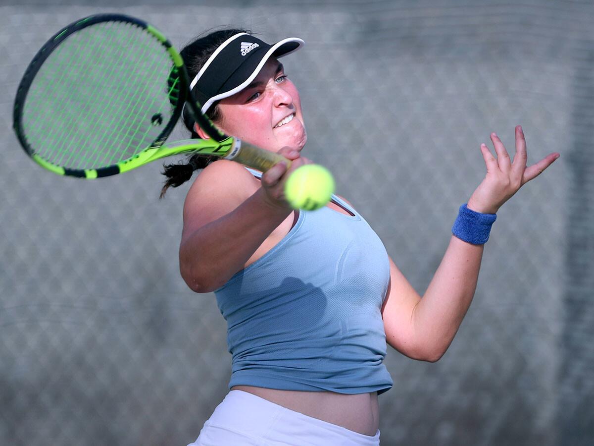 Corona del Mar High singles player Janie Marcus returns the ball against Long Beach Wilson's Bella Nguyen in the the CIF Southern Section Individuals tournament round of 32 match at Whittier Narrows Tennis Center in South El Monte on Tuesday, Nov. 27, 2018.