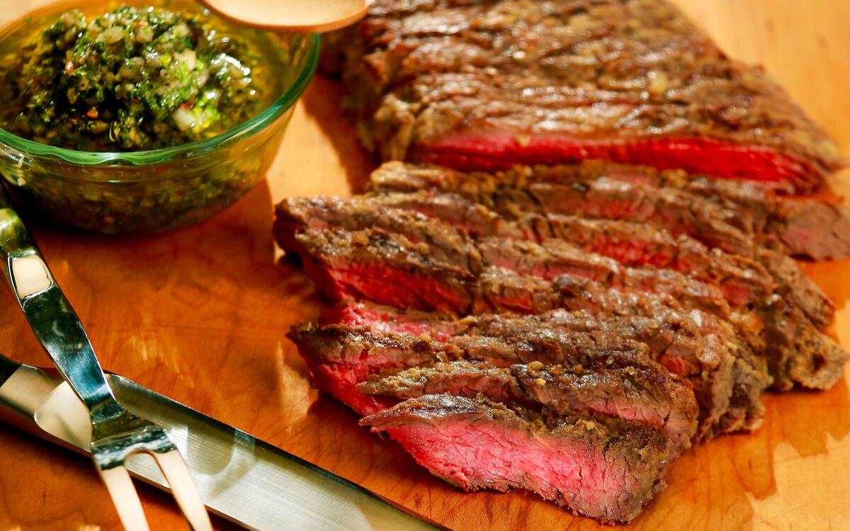 Grilled beef skirt steak with onion marinade and chimichurri