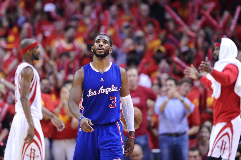 The Clippers' Chris Paul walks off the court during a timeout in Game 7 of the playoff series against the Houston Rockets on May 17.
