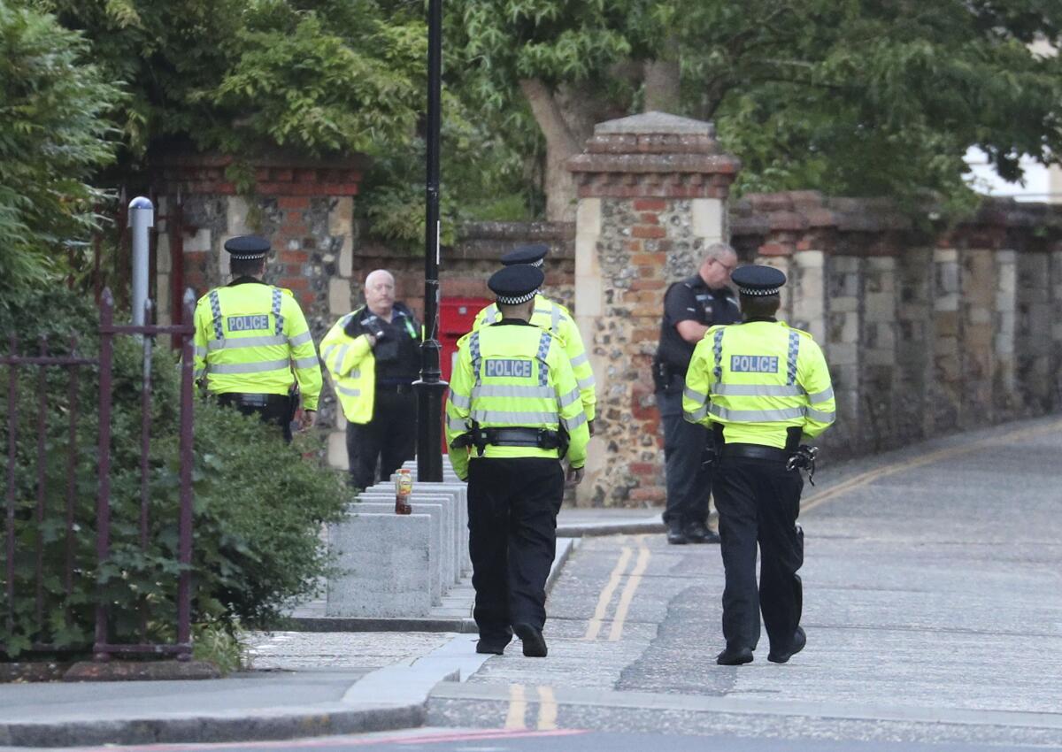 Police arrive at Forbury Gardens in the town center of Reading, England