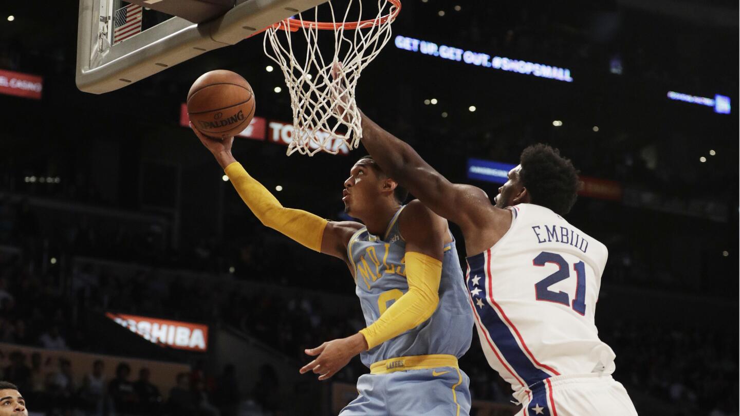 Lakers guard Jordan Clarkson drives to the basket against Philadelphia 76ers center Joel Embiid in the 4th quarter.
