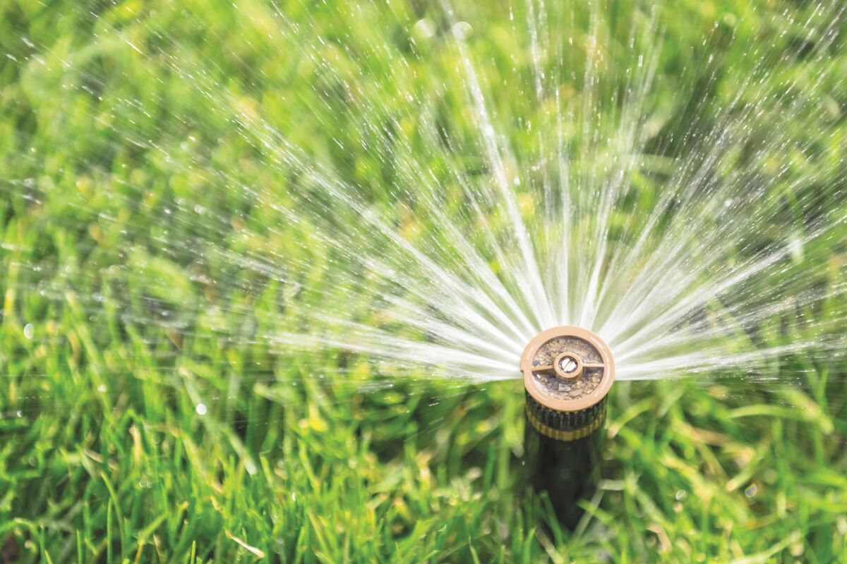 Pop-up underground sprinkler systems spray water over a large area, but allow half of it to be evaporated on hot, windy days.