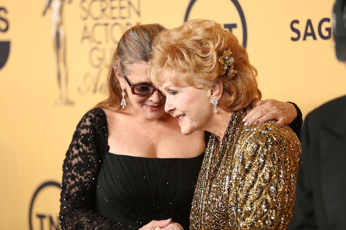 Debbie Reynolds with daughter Carrie Fisher at the Screen Actors Guild Awards at the Shrine Auditorium in Los Angeles on Jan. 25, 2015.