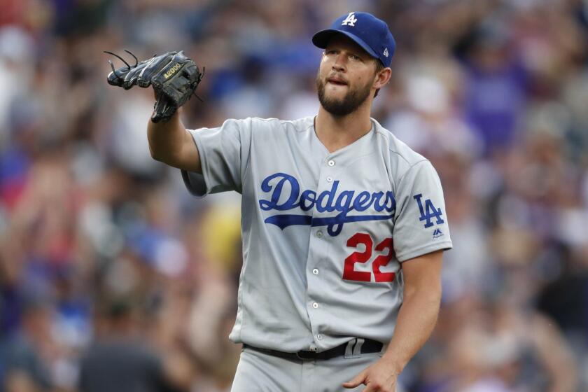 Los Angeles Dodgers starting pitcher Clayton Kershaw waits for a new ball after giving up a two-run home run to Colorado Rockies' Charlie Blackmon during the third inning of a baseball game Saturday, June 29, 2019, in Denver. (AP Photo/David Zalubowski)