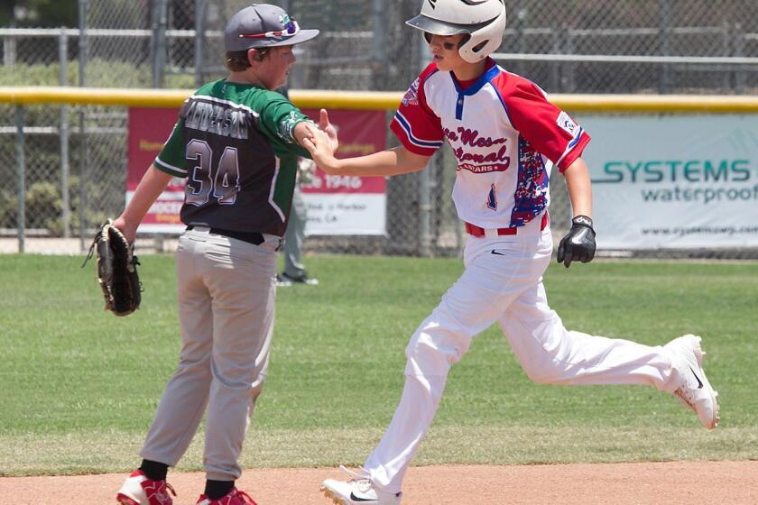 Kaiden Kahkosko of Costa Mesa National rounds the bases after hitting a homer in the annual Mayor's Cup series at Costa Mesa high on Saturday.
