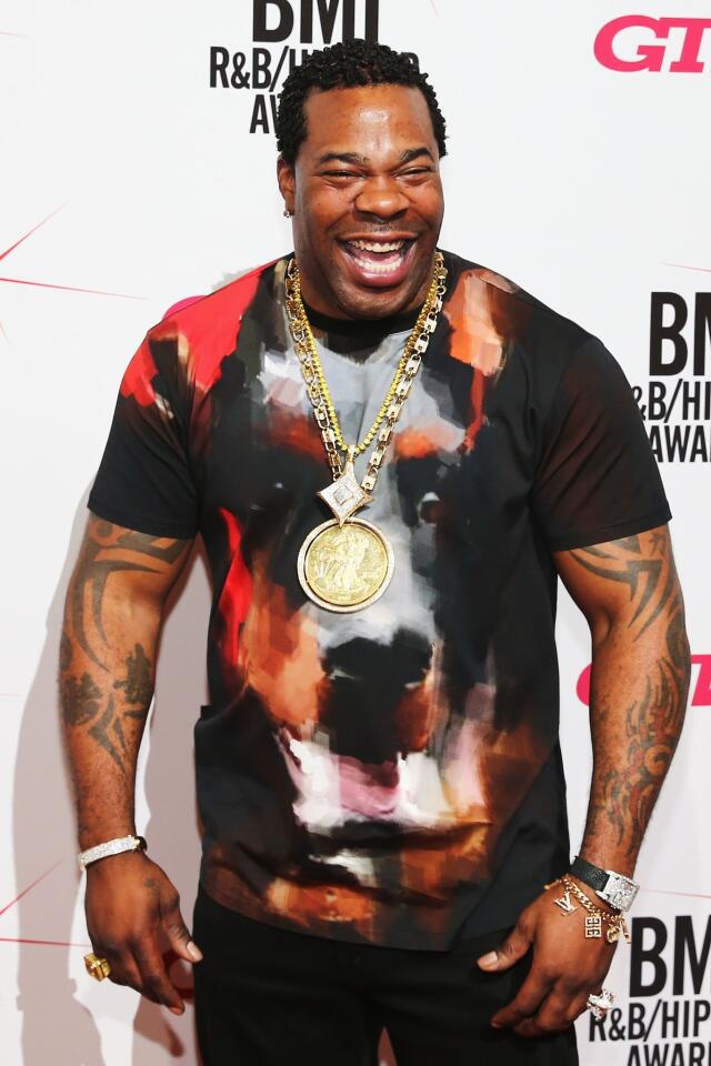 Busta Rhymes wears some serious bling, along with this impressionistic T-shirt of a Doberman pinscher.
