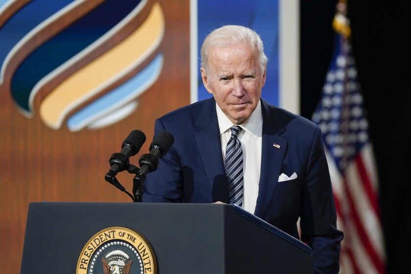 President Joe Biden listens to questions from members of the media after delivering closing remarks to the virtual Summit for Democracy, in the South Court Auditorium on the White House campus, Friday, Dec. 10, 2021, in Washington. (AP Photo/Evan Vucci)