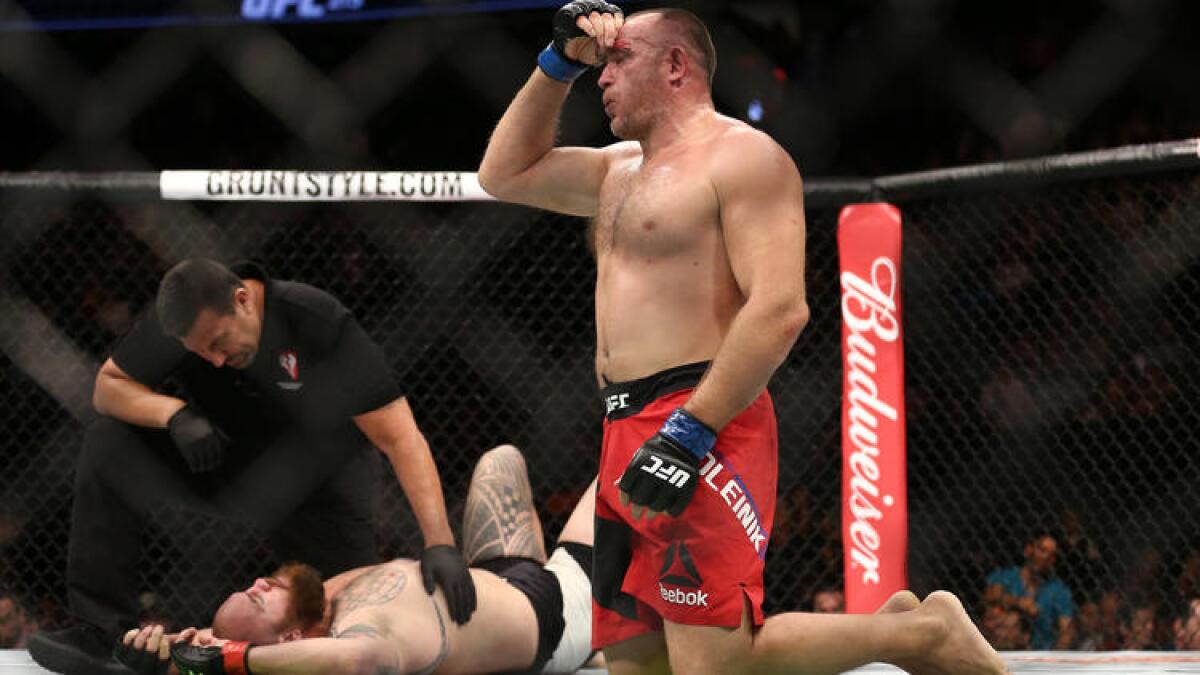 Oleksiy Oliynyk reacts after defeating Travis Browne in their heavyweight bout at UFC 213.