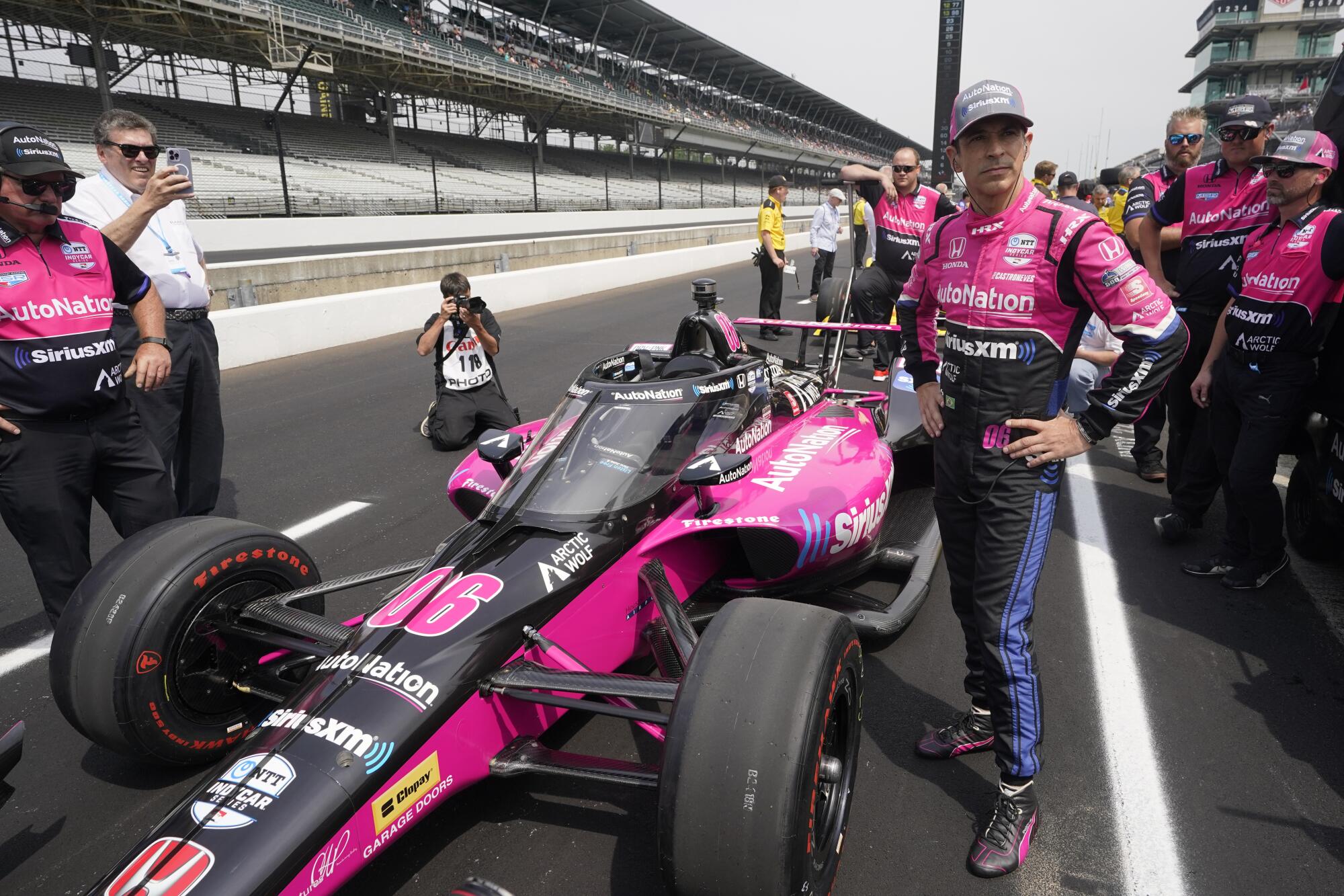 Helio Castroneves stands by his car during Indianapolis 500 qualifying on May 21.