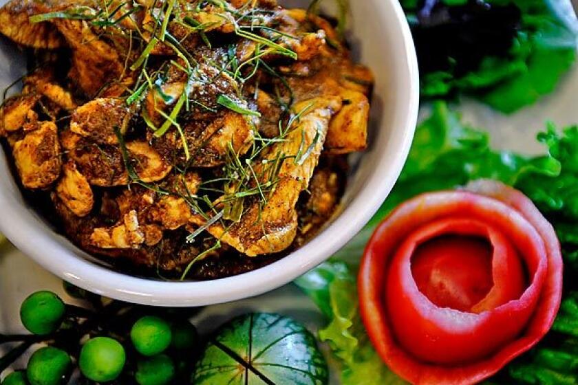 Kuah gling with chicken is a southern-style dry meat curry.