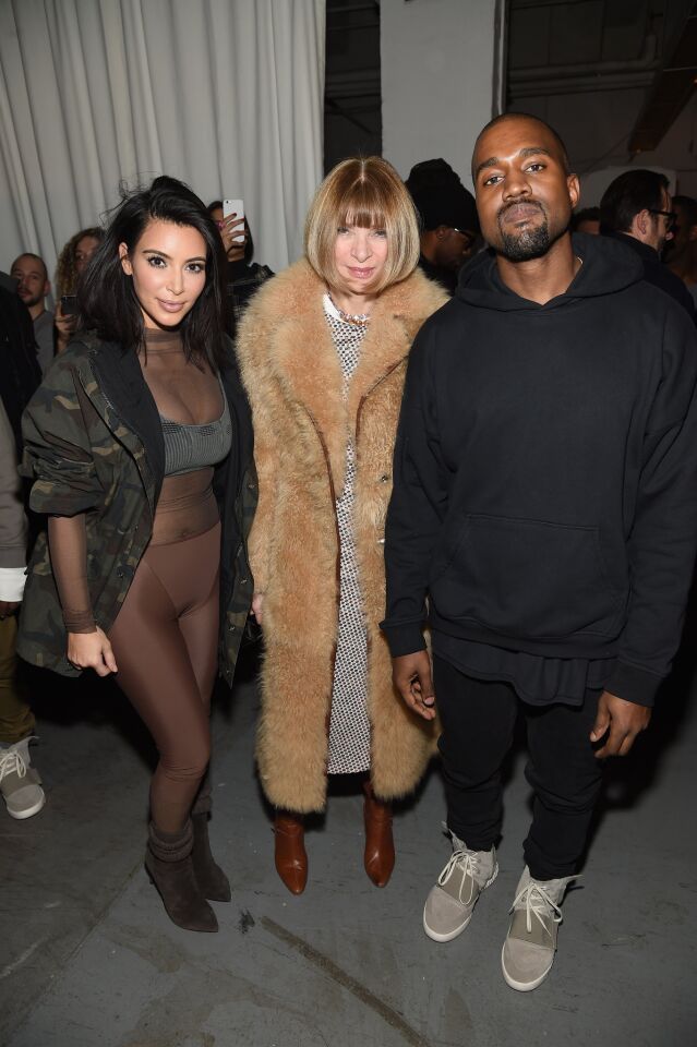 Kardashian and West pose with formidable Vogue editor and friend Anna Wintour, center, at the Adidas Originals x Kanye West fashion show on Feb. 12, 2015.